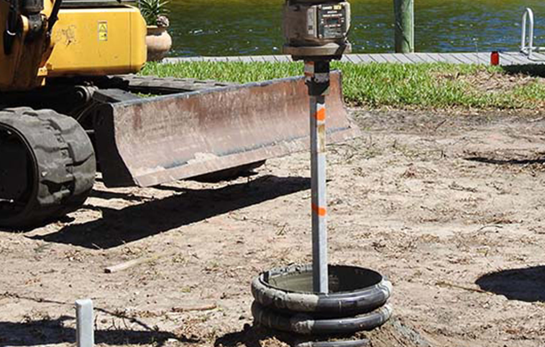 https://coastalfoundationsolutions.com/wp-content/uploads/2023/04/micro-pulldown-pile-installation.jpg